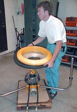 weir man installing core suction oil skimmer
